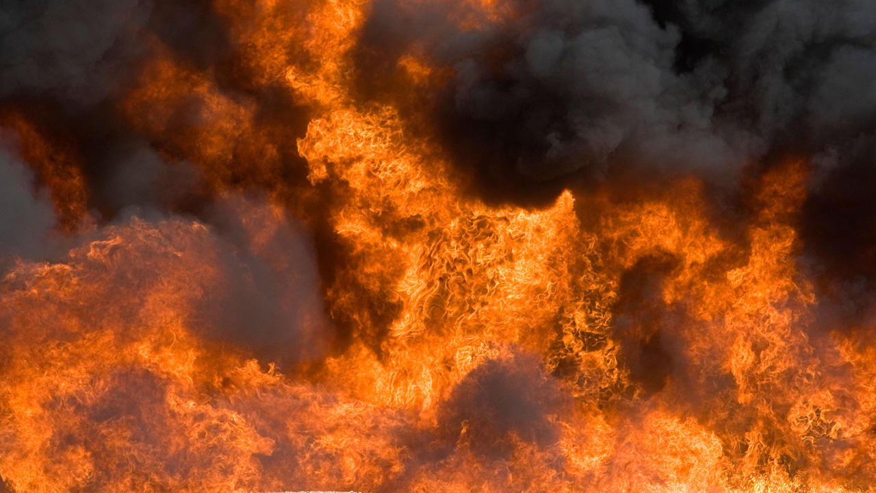 Jet fuel fire at an airport firefigher training facility